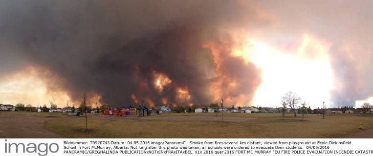 Smoke from fires several km distant, viewed from playground at Ecole Dickinsfield School in Fort McMurray, Alberta. Not long after this photo was taken, all schools were ordered to evacuate their students. 04 05 2016 PANORAMIC GREGHALINDA 