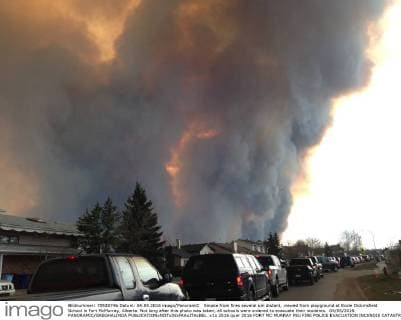 Smoke from fires several km distant, viewed from playground at Ecole Dickinsfield School in Fort McMurray, Alberta. Not long after this photo was taken, all schools were ordered to evacuate their students. 04 05 2016 PANORAMIC GREGHALINDA 