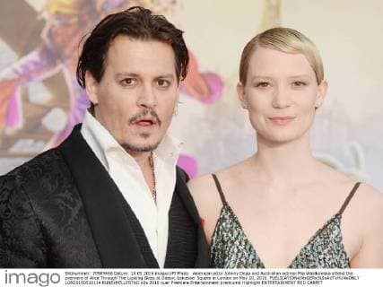American actor Johnny Depp and Australian actress Mia Wasikowska attend the premiere of Alice Through The Looking Glass at Odeon, Leicester Square in London on May 10, 2016.  LON20160510114 RUNExHELLESTAD