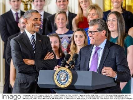 May 10, 2016 - Washington Dc, USA - May 10, 2016: President BARACK OBAMA looks on as UConn Head Coach GENO AURIEMMA speaks during the ceremony honoring the UConn Women s basketball team on their 2016 NCAA Championship, their fourth in a row, in the East Room at the White House in Washington DC. Washington Dc USA - ZUMAs125