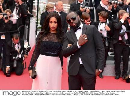May 14, 2016 - Cannes, France - Congolese-born French rapper Maitre Gims (R) and his wife DemDem pose on May 14, 2016 as they arrive for the screening of the film The BFG at the 69th Cannes Film Festival in Cannes, southern France. Cannes France  - ZUMAn230
