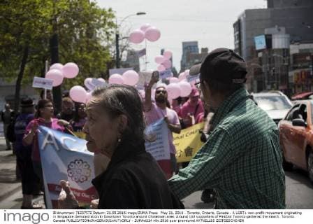 May 21, 2016 - Toronto, Ontario, Canada - A LGBT+ non-profit movement originating in Singapore demonstration in Downtown Toronto around Chinatown area. Around 100 supporters of PinkDot Toronto gathered the march. Toronto Canada - ZUMAd114