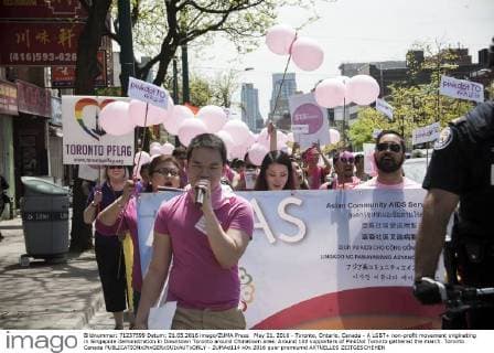 May 21, 2016 - Toronto, Ontario, Canada - A LGBT+ non-profit movement originating in Singapore demonstration in Downtown Toronto around Chinatown area. Around 100 supporters of PinkDot Toronto gathered the march. Toronto Canada - ZUMAd114