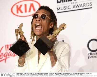 Singer Wiz Khalifa appears backstage with the Top Hot 100 Song Award for See You Again (with Charlie Puth) during the annual Billboard Music Awards held at T-Mobile Arena in Las Vegas, Nevada on May 22, 2016.  LAV20160522113 JIMxRUYMEN