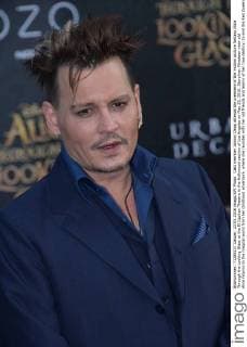 Cast member Johnny Depp attends the premiere of the motion picture fantasy Alice Through the Looking Glass at the El Capitan Theatre in the Hollywood section of Los Angeles on May 23, 2016. Storyline: Nineteen-year-old Alice returns to the magical world from her childhood adventure, where she reunites with her old friends and learns of her true destiny: to end the Red Queen s reign of terror.  LAP2016052305 JIMxRUYMEN