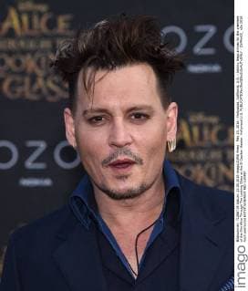 May 23, 2016 - Hollywood, California, U.S. - Johnny Depp arrives for the premiere of the film Alice Through The Looking Glass at the El Capitan theater. Hollywood U.S. - ZUMAo05_