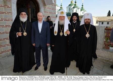 GREECE - MAY 28, 2016: Russia s President Vladimir Putin (2nd L), Patriarch Kirill of Moscow and All Russia (3rd R), and Metropolitan Hilarion (R) of Volokolamsk, chairman of the Department of External Church Relations of the Moscow Patriarchate, at the Monastery of St. Panteleimon on Mount Athos. Alexei Druzhinin Russian Presidential Press and Information Office TASS  TS024EA6