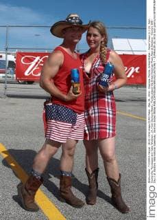 May 28, 2016 - Daytona, Florida, United States - Aaron Vinson (L), 21, from Cookeville, Tennessee and Katie Widdison, 24, from Daytona Beach, Florida attend the Great American Music Fest at Daytona - Country 500 - Day 2 at Daytona International Speedway. Daytona United States - ZUMAw109