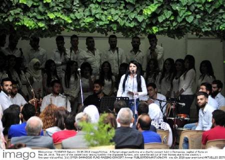 A Syrian singer performs at a charity concert held in Damascus, capital of Syria on May 28, 2016. The aim of the concert was raising fund for the displaced Syrians, who were forced out of their homes due to the country s five-year-old conflict. )(cl) SYRIA-DAMASCUS-FUND-RAISING-CONCERT Ammar 