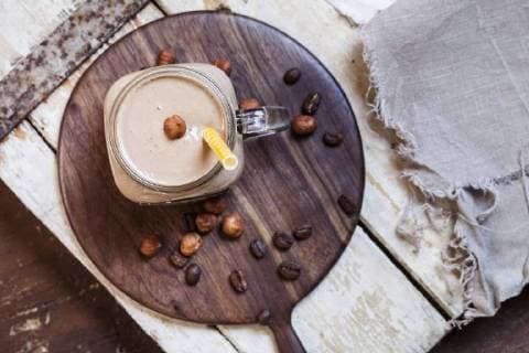Glass of smoothie with coffee, roasted hazelnuts and chia seeds  SBDF002891