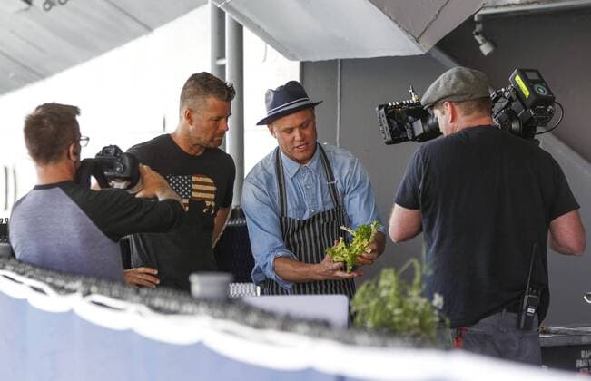 May 30, 2016 - San Diego, USA - SAN DIEGO, May 29, 2016 Local chef Brian Malarkey, center, cooks with host Pete Evans, second from left, as a film crew tapes an episode of the PBS cooking show Moveable Feast with Fine Cooking while aboard the USS Midway Museum in San Diego on Monday. Photo by Hayne Palmour IV San Diego Union-Tribune Mandatory Credit: HAYNE PALMOUR IV SAN DIEGO UNION-TRIBUNE ZUMA PRESS San Diego Union-Tribune Photo by Hayne Palmour IV copyright 2016 San Diego USA - ZUMAs44_