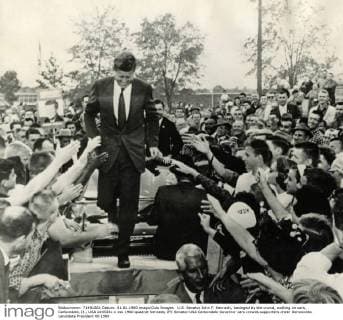 U.S. Senator John F. Kennedy, besieged by the crowd, walking on cars, Carbondale, Ill., USA x04533x 