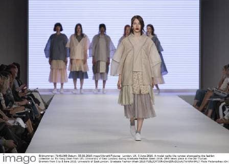 London, UK. 5 June 2016. A model walks the runway showcasing the fashion collection by Thi Hang Doan from UEL (University of East London) during Graduate Fashion Week 2016. GFW takes place at the Old Truman Brewery from 5 to 8 June 2016. University of East London, Graduate Fashion Week 2016 