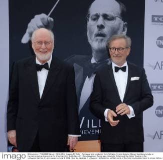 Composer and conductor John Williams (L) and director Steven Spielberg mingle on the red carpet as they arrive for American Film Institutes 44th Life Achievement Award gala tribute to Williams at the Dolby Theatre in the Hollywood section of Los Angeles on June 9, 2016. Over six decades in Hollywood, Williams has written some of the most memorable music in movie history. His 100-plus features have earned 50 Academy Award nominations (making him the most-nominated living person), winning five times. Williams also received 22 Grammys, seven BAFTAs, five Emmys, four Golden Globes, a Kennedy Center Honor and the National Medal of Arts. And then there are all those iconic themes, the ones everyone in the world knows.  LAP2016060905 JIMxRUYMEN