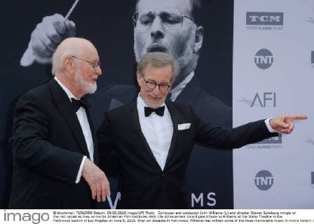 Composer and conductor John Williams (L) and director Steven Spielberg mingle on the red carpet as they arrive for American Film Institutes 44th Life Achievement Award gala tribute to Williams at the Dolby Theatre in the Hollywood section of Los Angeles on June 9, 2016. Over six decades in Hollywood, Williams has written some of the most memorable music in movie history. His 100-plus features have earned 50 Academy Award nominations (making him the most-nominated living person), winning five times. Williams also received 22 Grammys, seven BAFTAs, five Emmys, four Golden Globes, a Kennedy Center Honor and the National Medal of Arts. And then there are all those iconic themes, the ones everyone in the world knows.  LAP2016060910 JIMxRUYMEN