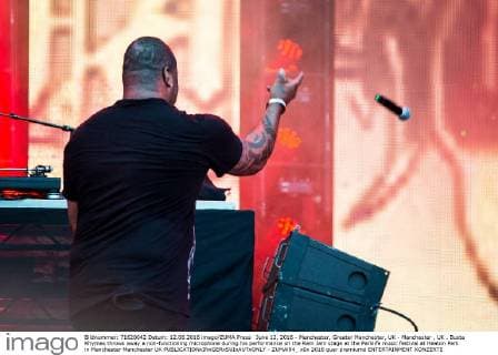 June 12, 2016 - Manchester, Greater Manchester, UK - Manchester , UK . Busta Rhymes throws away a non-functioning microphone during his performance on the Ram Jam stage at the Parklife music festival at Heaton Park in Manchester Manchester UK  - ZUMAl94_