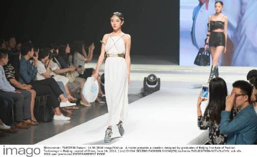 A model presents a creation designed by graduates of Beijing Institute of Fashion Technology in Beijing, capital of China, June 14, 2016. ) (ry) CHINA-BEIJING-FASHION SHOW(CN) LixJianbo 