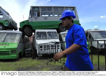 (160616) -- MEXICO CITY, June 16, 2016 -- A worker works during the start of the scrappage process of minibuses, in Mexico City, capital of Mexico, on June 15, 2016. According to local press, as Mexico City Mayor Miguel Angel Mancera announced last week the substitution of the minibuses for less pollutant vehicles to offer the public transportation service, the scrappage process began on Wednesday. Str) (da) (fnc) MEXICO-MEXICO CITY-TRANSPORTATION-SCRAPPAGE e STR 