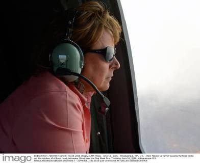 June 16, 2016 - Albuquerque, NM, U.S. - New Mexico Governor Susana Martinez looks out the window of a Black Hawk helicopter flying over the Dog Head Fire, Thursday June 16, 2016. Albuquerque U.S. - ZUMAab1_
