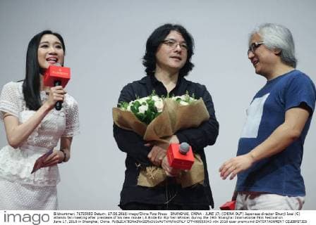 SHANGHAI, CHINA - JUNE 17: (CHINA OUT) Japanese director Shunji Iwai (C) attends fan meeting after premiere of his new movie A Bride for Rip Van Winkle during the 19th Shanghai International Film Festival on June 17, 2016 in Shanghai, China.  CFP486653343