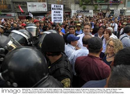 Policemen block a march of education workers in Mexico City, capital of Mexico, June 17, 2016. The march was held to oppose the education reform promulgated in 2013 by Mexico s President Enrique Pena Nieto. ) (jp) (rtg) MEXICO-MEXICO CITY-EDUCATION WORKERS-MARCH STR 