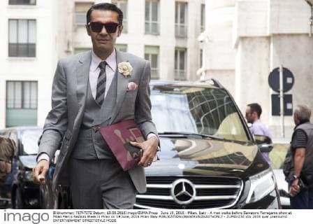 June 19, 2016 - Milan, Italy - A man walks before Salvatore Ferragamo show at Milan Men s Fashion Week in Milan on 19 June, 2016 Milan Italy  - ZUMAn230