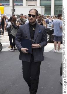 June 19, 2016 - Milan, Italy - A man walks before Salvatore Ferragamo show at Milan Men s Fashion Week in Milan on 19 June, 2016 Milan Italy  - ZUMAn230