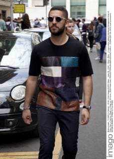 June 19, 2016 - Milan, Italy - A man walks before Salvatore Ferragamo show at Milan Men s Fashion Week in Milan on 19 June, 2016 Milan Italy  - ZUMAn230