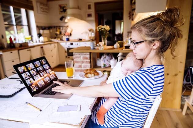 Mother with baby at home working with laptop model released Symbolfoto property released  HAPF000473