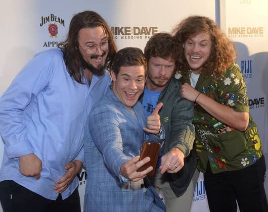Cast member Adam Devine (C) does a selfie with actors Kyle Newacheck, Anders Holm and Blake Anderson (L-R) during the premiere of the motion picture comedy Mike and Dave Need Wedding Dates at the ArcLight Cinema Dome in the Hollywood section of Los Angeles on June 29, 2016. Storyline: Hard-partying brothers place an online ad to find the perfect dates for their sister s Hawaiian wedding. Hoping for a wild getaway, the boys instead find themselves outsmarted and out-partied by the uncontrollable duo.  LAP2016062907 JIMxRUYMEN