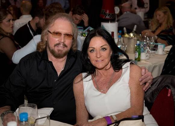 British Bee Gees pop singer-songwriter Barry Gibb and wife attending the 2016 O2 Silver Clef Awards at the Grosvenor Mariott Hotel, in London. JULY 1st 2016  DFLx162105