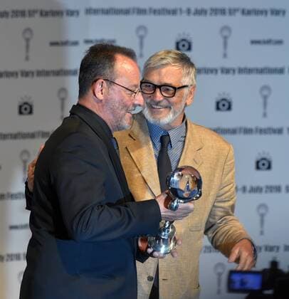 French actor Jean Reno, left, holds the Festival President s Award at the 51st Karlovy Vary International Film Festival in Karlovy Vary, Czech Republic, July 4, 2016. At right is Film Festival President Jiri Bartoska. (CTKxPhoto SlavomirxKubes) CTKPhotoP201607040863601  KBS_0041