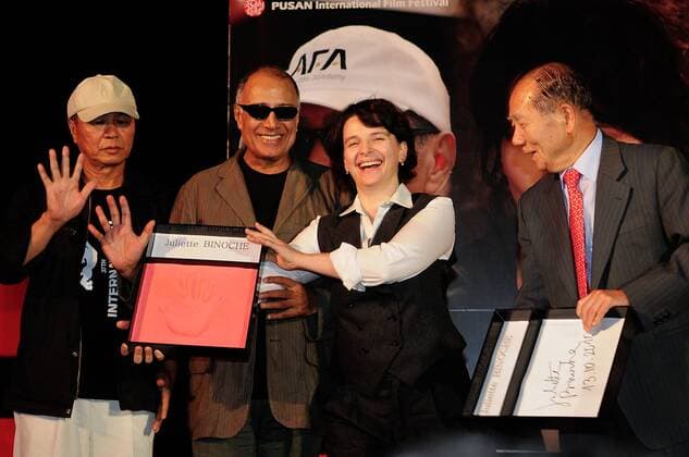 Oct 13, 2010 - Pusan, Korea - L-R Director HOU HSIAO-HSIEN, Iran writer ABBAS KIAROSTAMI, JULIETTE BINOCHE and Festival director KIM DONGHO at hand printing event at Haeundae beach during the 15th Pusan International Film Festival..  - ZUMAe70_