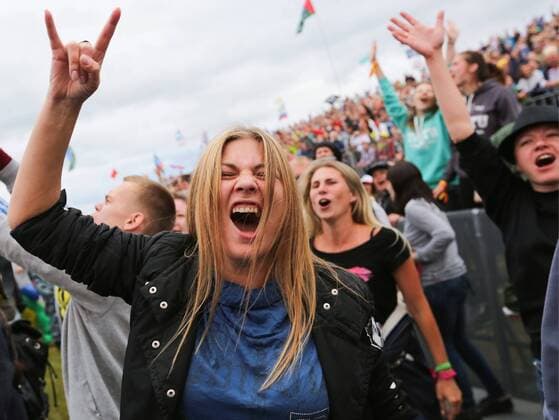 TVER REGION, RUSSIA - JULY 8, 2016: People attend the 16th Nashestvie (Invasion) rock music festival in the village of Bolshoye Zavidovo. Alexander Ryumin TASS  TS02969D
