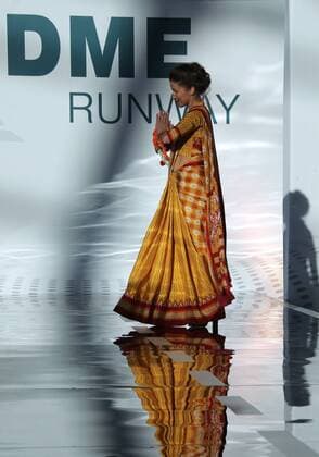 MOSCOW REGION, RUSSIA - JULY 12, 2016: An Air India employee showcases clothes during the 2016 DME Runway fashion show marking International Flight Attendant Day at Domodedovo International Airport. Mikhail Metzel TASS  TS029C2B