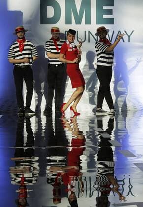 MOSCOW REGION, RUSSIA - JULY 12, 2016: Ural Airlines employees showcase clothes during the 2016 DME Runway fashion show marking International Flight Attendant Day at Domodedovo International Airport. Mikhail Metzel TASS  TS029C2E