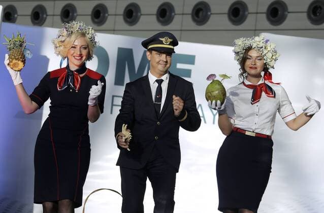 MOSCOW REGION, RUSSIA - JULY 12, 2016: Azur Air employees showcase clothes during the 2016 DME Runway fashion show marking International Flight Attendant Day at Domodedovo International Airport. Mikhail Metzel TASS  TS029C3F