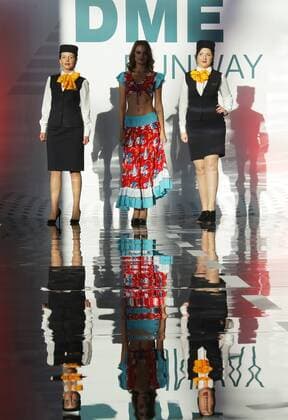 MOSCOW REGION, RUSSIA - JULY 12, 2016: Lufthansa employees showcase clothes during the 2016 DME Runway fashion show marking International Flight Attendant Day at Domodedovo International Airport. Mikhail Metzel TASS  TS029C61