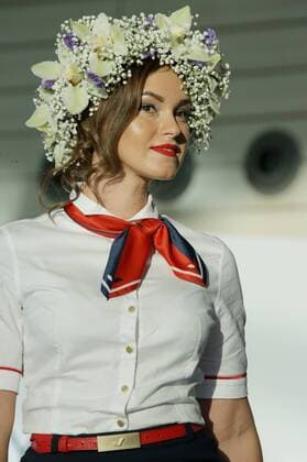 MOSCOW REGION, RUSSIA - JULY 12, 2016: An Azur Air employee showcases clothes during the 2016 DME Runway fashion show marking International Flight Attendant Day at Domodedovo International Airport. Mikhail Metzel TASS  TS029C6E