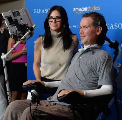 Actress Courtney Cox and Steve Gleason attend the motion picture documentary Gleason at Regal L.A. Live in Los Angeles on July 14, 2016. Storyline: At the age of 34, Steve Gleason was diagnosed with ALS. Doctors gave the former NFL defensive back and New Orleans hero two to five years to live. So that is what Steve chose to do - LIVE: with purpose, for his newborn son, for his wife, and to help others with his disease.  LAP2016071403 JIMxRUYMEN