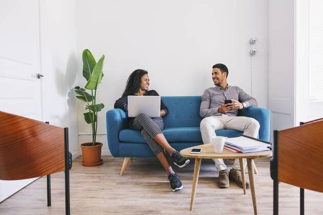 Young business people working relaxed on couch model released Symbolfoto property released  EBSF001444