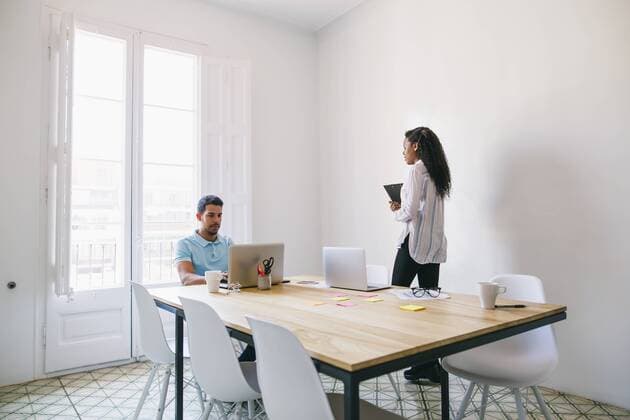 Young businessman and woman working in office model released Symbolfoto property released  EBSF001539
