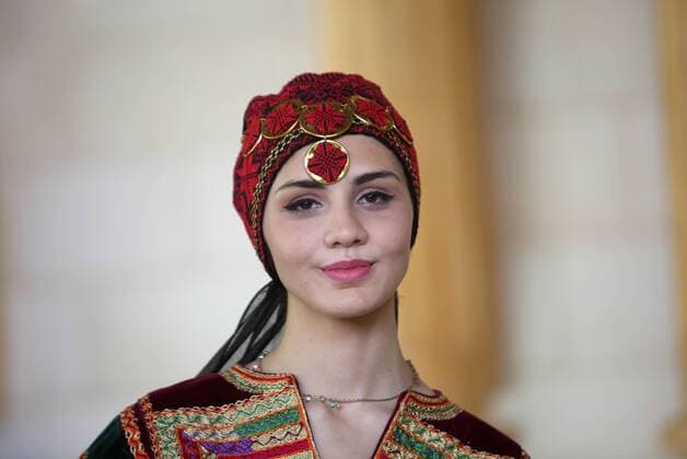 (160725) -- JENIN, July 25, 2016 -- A Palestinian model displays a traditional Palestinian dress during a fashion show in celebration of Palestinian Traditional Dress and Heritage Day at Haddad village near the West Bank city of Jenin, July 25, 2016. ) MIDEAST-JENIN-HERITAGE DAY AymanxNobani 