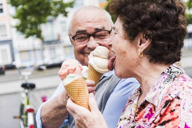 Senior couple enjoy eating ice cream together model released Symbolfoto  UUF008054