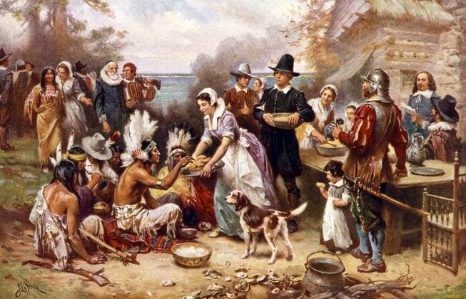 The first Thanksgiving 1621 by Jean Leon Gerome Ferris, 1863-1930, artist. Published by the Foundation Press, Inc., c1932. photomechanical print halftone, colour. Pilgrims and Natives gather to share meal. WHA  !ACHTUNG AUFNAHMEDATUM GESCHÄTZT! Copyright: WHA UnitedArchivesWHA_039_0310