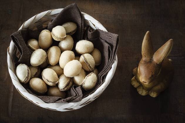 Easter bunny and basket of waffle eggs on dark wood  EVGF002986