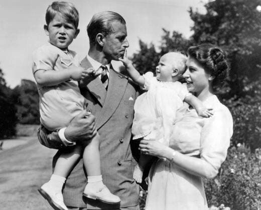 Photograph of Queen Elizabeth II (1926-) and the Duke of Edinburgh, Prince Phillip (1921-) holding Prince Charles (1948-) and Princess Anne (1950). Dated 1952 WHA  !ACHTUNG AUFNAHMEDATUM GESCHÄTZT! Copyright: WHA UnitedArchivesWHA_055_0007