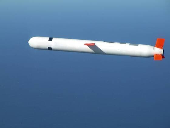 China Lake, California, November 10, 2002 - A Tactical Tomahawk Block IV cruise missile conducts a controlled flight test over the Naval Air Systems Command (NAVAIR) western test range complex in southern California. The Tactical Tomahawk, the next generation of Tomahawk cruise missile, adds the capability to reprogram the missile while in-flight to strike any of 15 preprogrammed alternate targets, or redirect the missile to any Global Positioning System (GPS) target coordinates. It also will be able to loiter over a target area for some hours, and with its on-board TV camera, will allow the war fighting commanders to assess battle damage of the target, and, if necessary redirect the missile to any other target.  Copyright: StocktrekxImages stk103041m