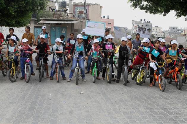 August 7, 2016 - Rafah, Gaza Strip, Palestinian Territory - Palestinian children take part in the bicycles marathon to demand their right to play and break the siege on Gaza strip, in Rafah in the southern Gaza Strip. on August 7, 2016 Rafah Palestinian Territory - ZUMAap3_