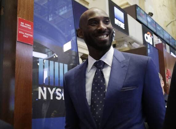 Kobe Bryant walks on the floor of the NYSE before Bryant Stibel Co-Founders and General Partners Kobe Bryant and Jeff Stibelt ring the opening bell at the New York Stock Exchange on Wall Street in New York City on August 22, 2016.  NYP20160822104 JOHNxANGELILLO